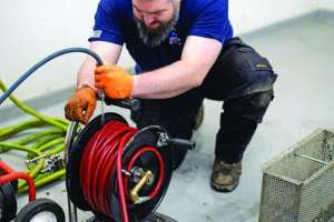 New Hampshire Drain Cleaner Takes On Challenging Service Area With a Smile